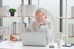 Senior man checking his investment portfolio, man with documents, retired elderly man reading documents