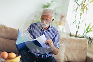 Senior man checking home finances.