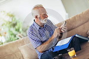 Senior man checking home finances.