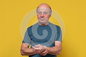 Senior man checking pulse measuring heart rate pulse on his wrist