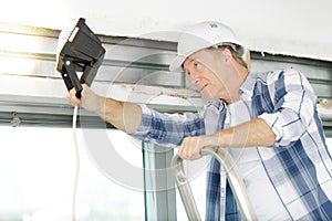 senior man checking state window