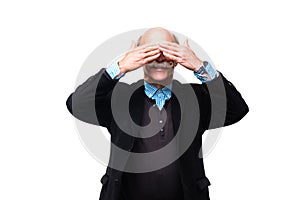 Senior man closed both his eyes with hands isolated on white background