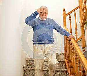 Man with faintness at the stairs home photo