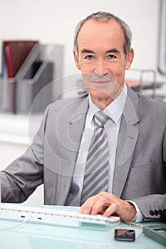 Senior man with computer