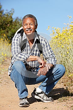 Senior man on country hike