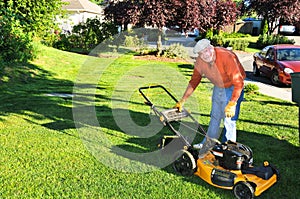 Senior Man Cutting Grass