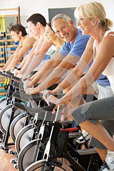 Senior Man Cycling In Spinning Class