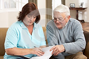 Senior Man In Discussion With Health Visitor