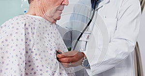 Senior man, doctor and breathing on stethoscope, checkup and consultation in hospital, health issue and lungs. Elderly