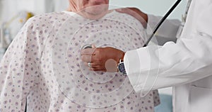 Senior man, doctor and hands listening to heart beat, rate or breathing in cardiology with patient at hospital. Closeup