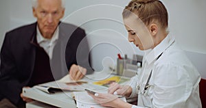 Senior man at the doctor at health clinic