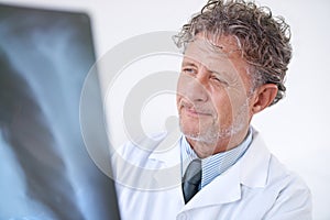 Senior man, doctor and xray for healthcare, injury analysis and anatomy with radiology and happiness. Mature, face and