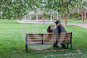 Senior Man with Dog on Bench in Park Northern Virginia