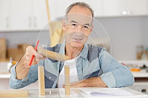 senior man doing diy