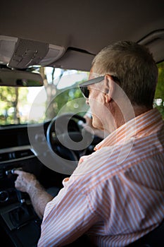 Senior man driving car