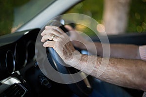 Senior man driving car