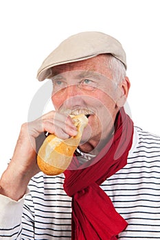 Senior man eating French bread