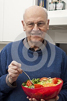 Senior man eating a healthy salad