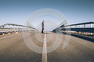 Senior man on the empty road - direction and freedom concept - globetrotter wanderlust photo