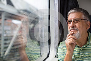 Senior man enjoying a train travel