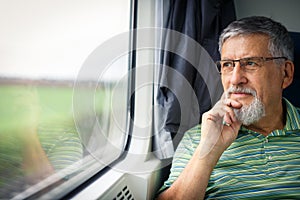 Senior man enjoying a train travel