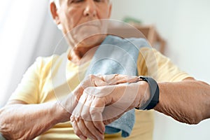 Senior man exercise at home health care measure pulse