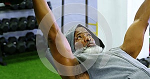 Senior man exercising with barbell weight 4k