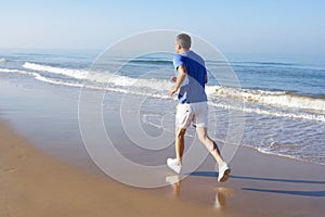 Senior Man Exercising On Beach