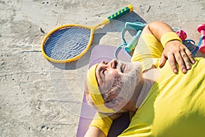 Senior man exercising on blue sky. Senior sportsman in sport center. Healthcare cheerful lifestyle. Sporting.