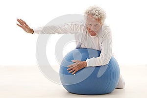 Senior man exercising at gym photo