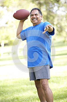 Senior Man Exercising In Park