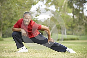 Senior Man Exercising In Park