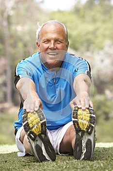 Senior Man Exercising In Park