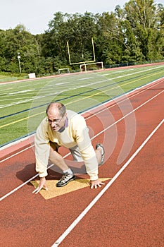 Senior man exercising sports field and run