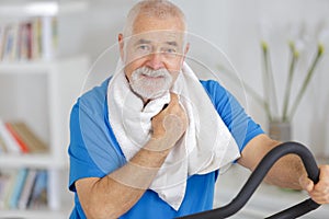 Senior man exercising on stepper