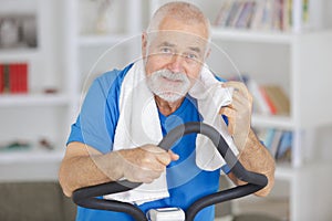 senior man exercising on stepper