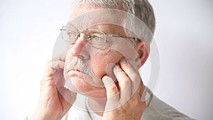 Senior man with facial pain
