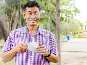 Senior man feel happy drinking coffee in the morning