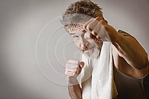 Senior man in fighting position