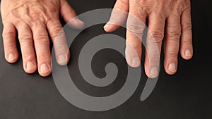 Senior man with finger tremors