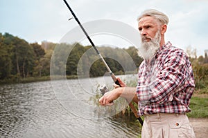 Senior man fishing on the river