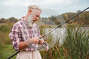 Senior man fishing on the river