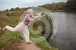 Senior man fishing on the river