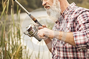 Senior man fishing on the river