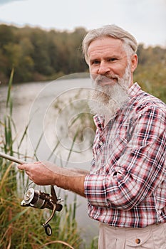 Senior man fishing on the river