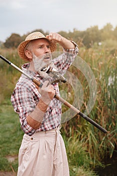 Senior man fishing on the river