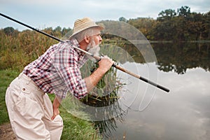 Senior man fishing on the river