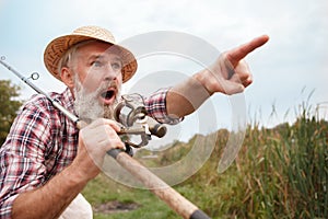 Senior man fishing on the river