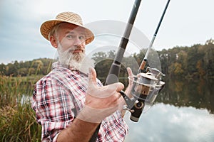 Senior man fishing on the river