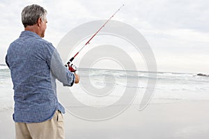 Senior man fishing in sea